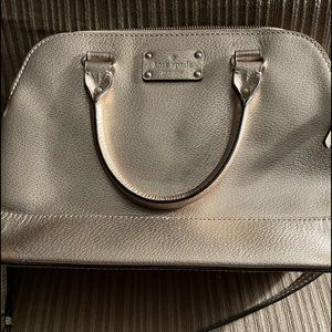 Rose gold Kate spade purse.